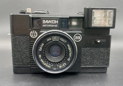Фотоаппарат "Эликон автофокус" в коробке с документами, пластик, стекло, Минский механический завод им. С.И. Вавилова (БелОМО), Беларусь, 1991 г.