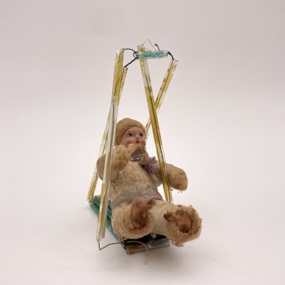 Елочная игрушка "Мальчик на качелях", вата, краска, стекло, СССР, 1937-1960 гг.