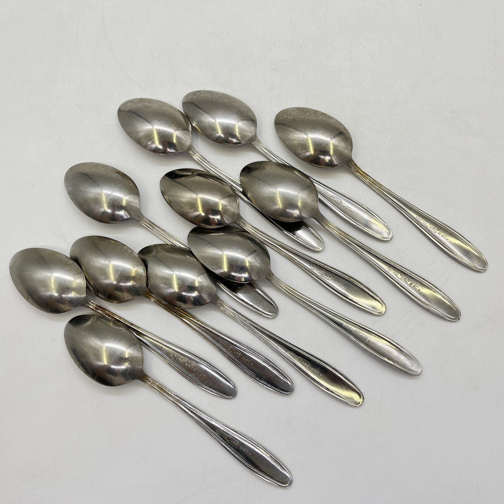 Набор из 11-ти чайных ложек с флоральным декором, завод "Серп и Молот", нержавеющая сталь, СССР, 1970-1990 гг.