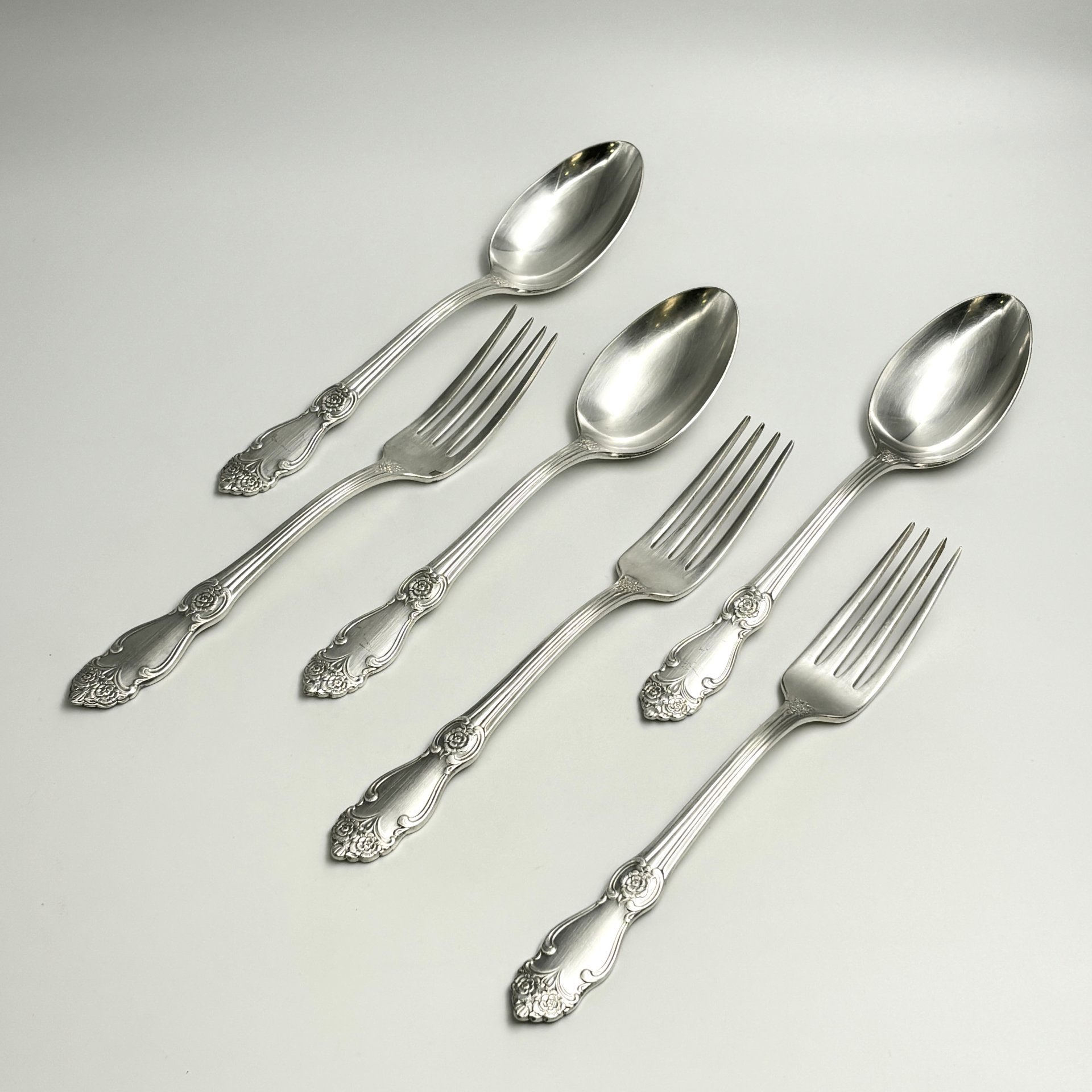 Набор столовых приборов на 3 персоны "Серебряная роза" (3 вилки и 3 ложки), мНЦ (медь-никель-цинк), Кольчугинский завод цветных металлов, СССР, 1970-1990 гг.