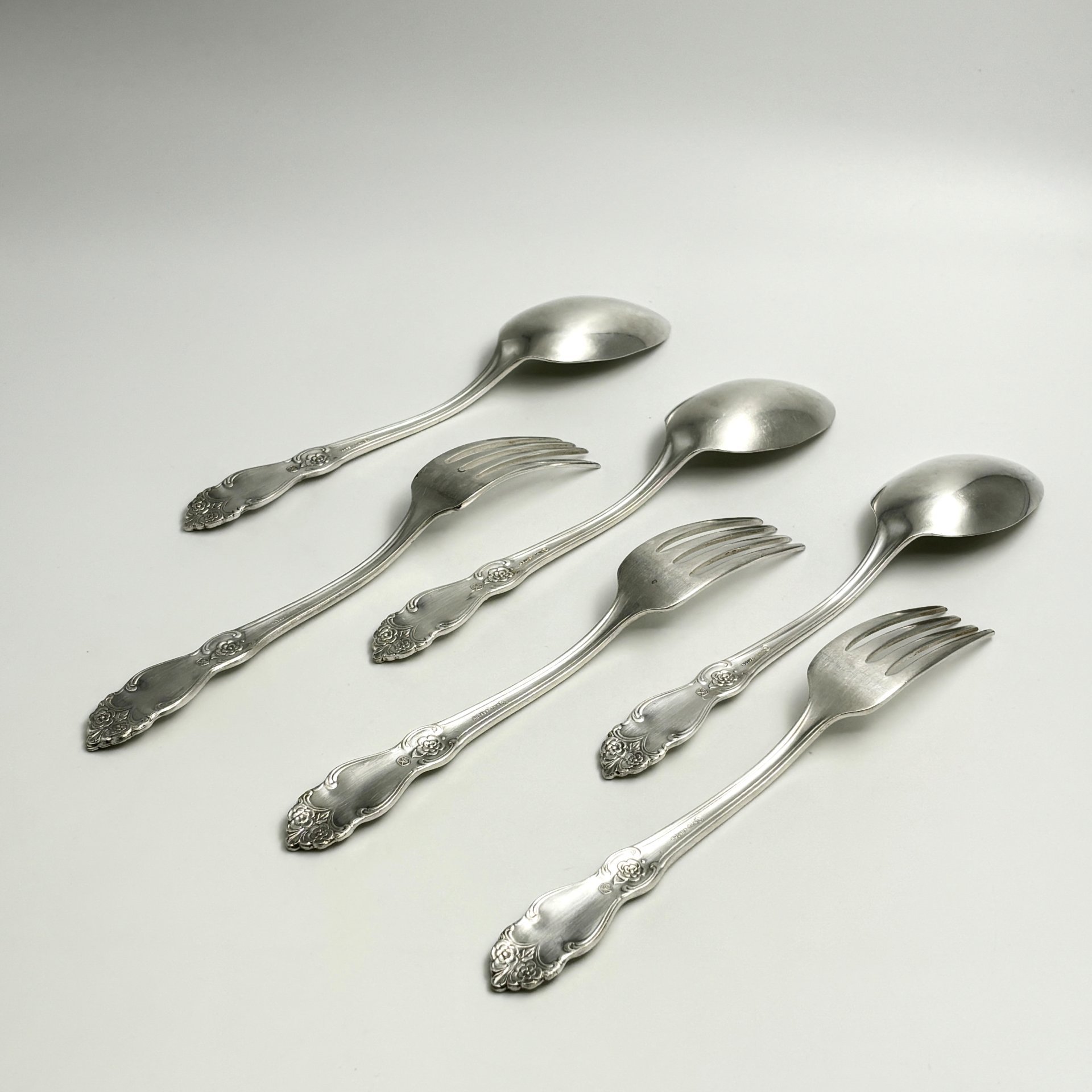 Набор столовых приборов на 3 персоны "Серебряная роза" (3 вилки и 3 ложки), мНЦ (медь-никель-цинк), Кольчугинский завод цветных металлов, СССР, 1970-1990 гг.