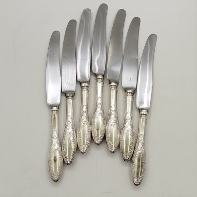 Набор из семи закусочных/десертных ножей "Пламя", мНЦ (медь-никель-цинк), сталь, Кольчугинский завод цветных металлов, СССР, 1960-1980 гг.