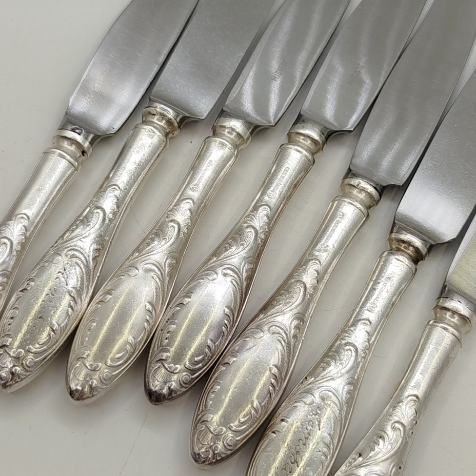 Набор из семи закусочных/десертных ножей "Пламя", мНЦ (медь-никель-цинк), сталь, Кольчугинский завод цветных металлов, СССР, 1960-1980 гг.