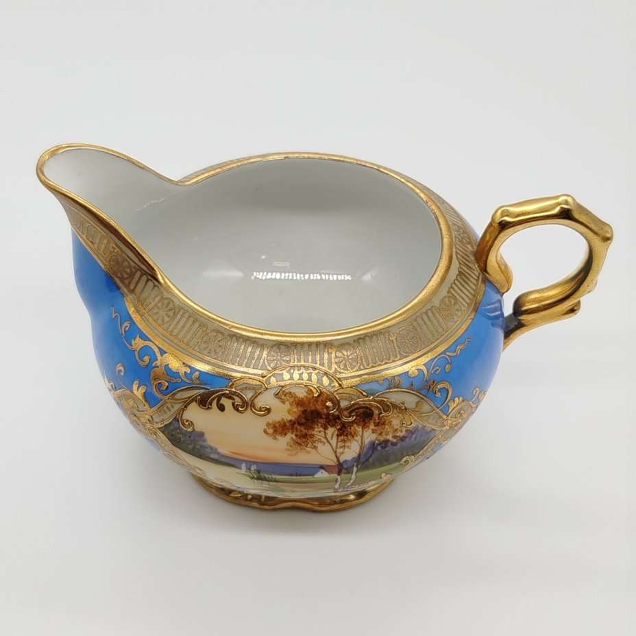 Молочник, украшенный изображением закатного пейзажа