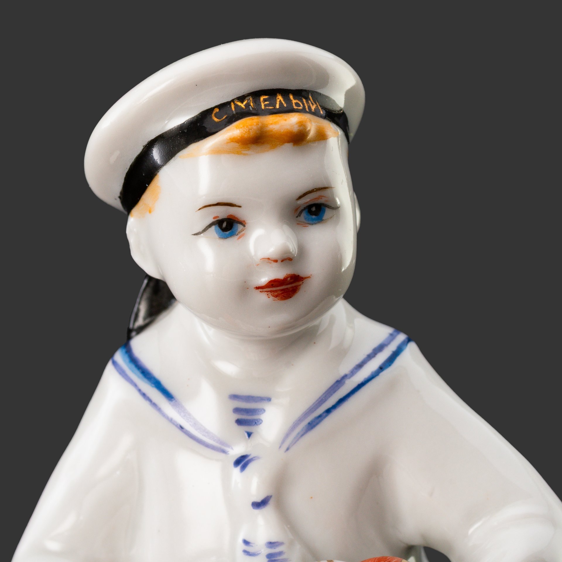 Статуэтка "Юный гармонист" (Морячок), скульптор Г.С. Столбова, художник Е.Н. Лупанова, фарфор, роспись, золочение, Ленинградский фарфоровый завод (ЛФЗ), СССР, 1960-1969 гг.