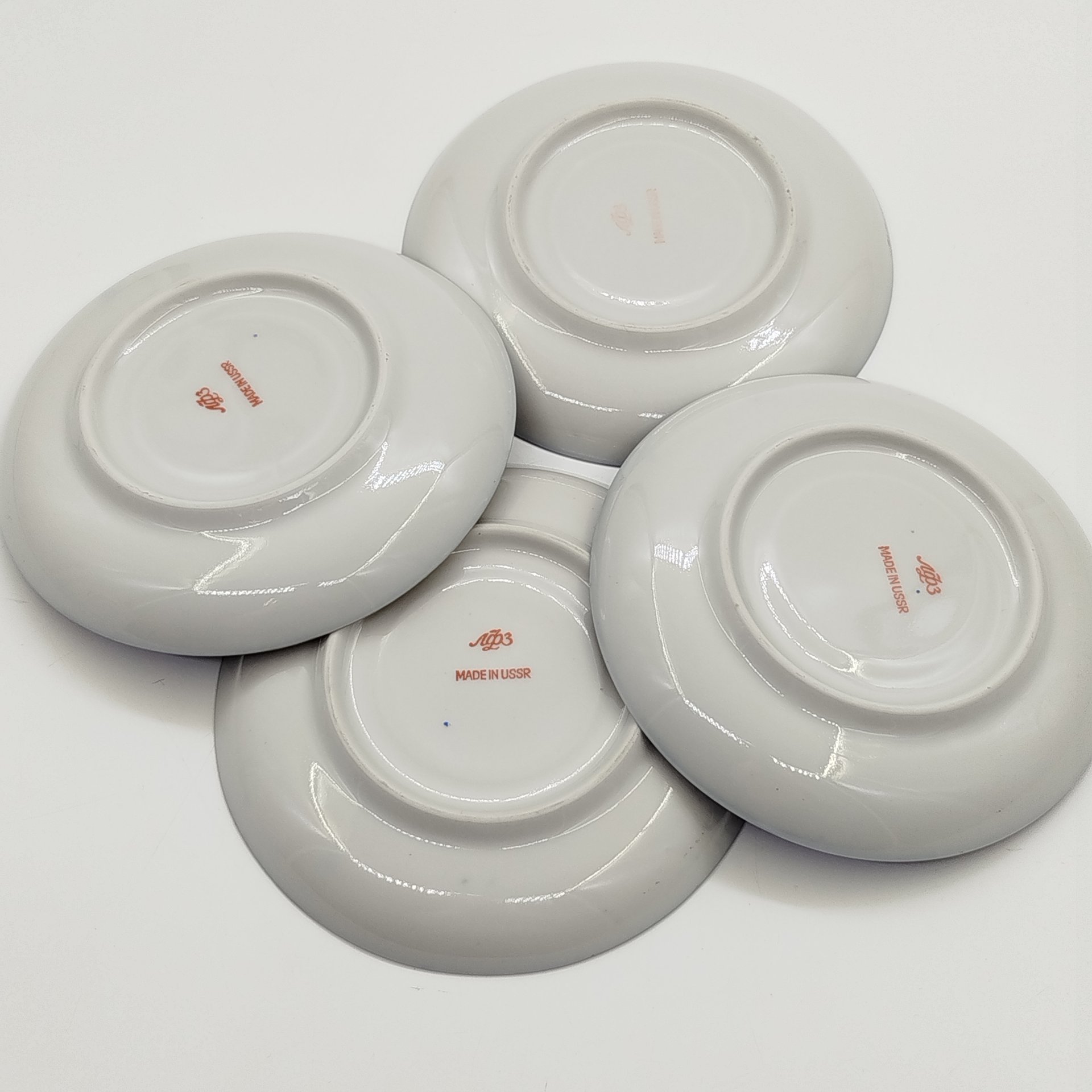 Набор из 4-х блюдец орнаментированных по борту, фарфор, крытье кобальтом, золочение, Ленинградский фарфоровый завод (ЛФЗ), СССР, 1970-1991 гг.