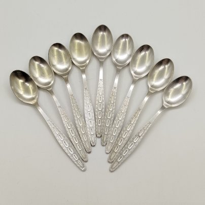 Набор из девяти чайных ложек с орнаментальным декором в коробке