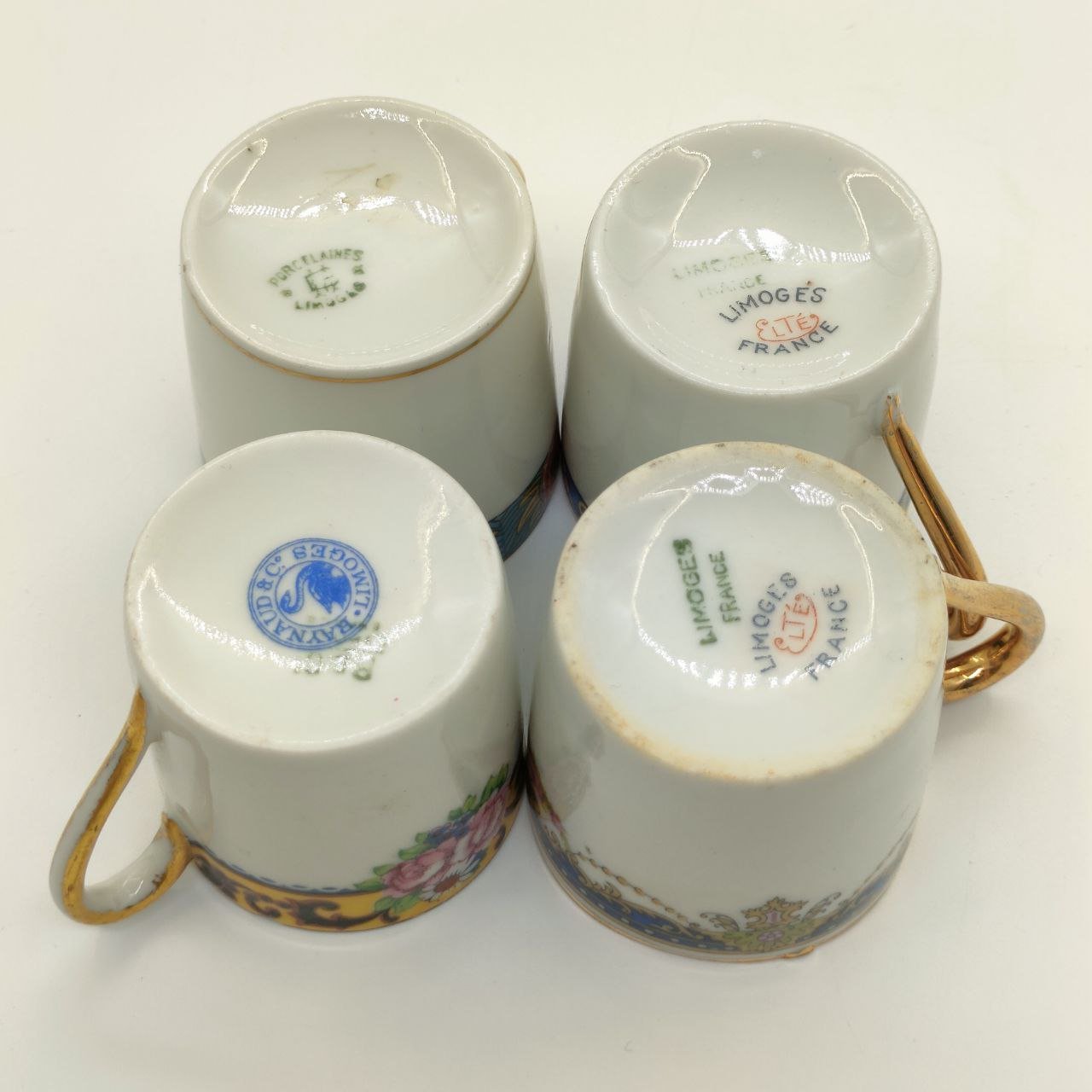 Набор из 4-х кофейных чашек, украшенных растительным декором (в подборе), форма "Литрон", фарфор, деколь, золочение, Limoges, Франция, 1920-1960 гг.