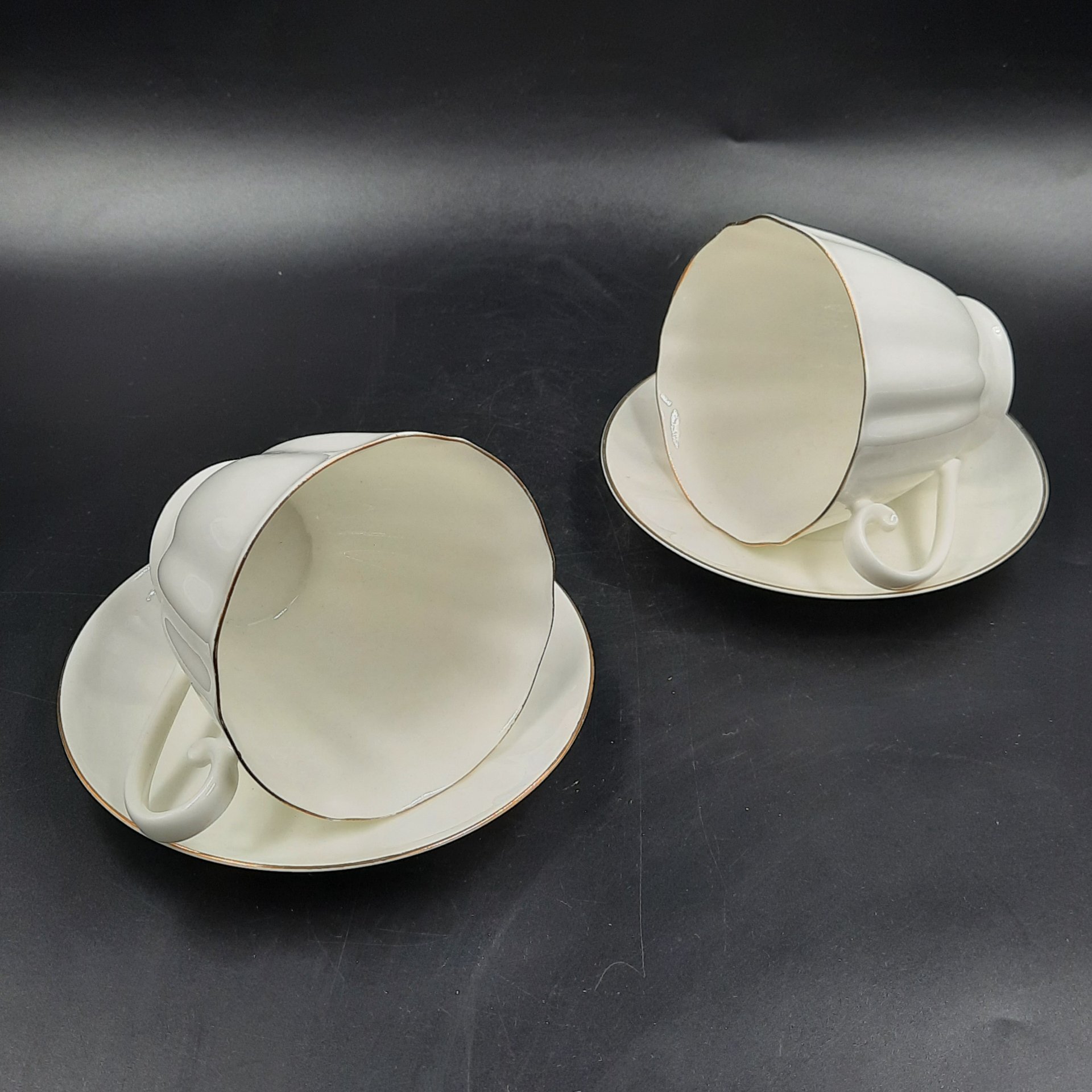 Набор из двух чайных пар "Золотой кантик", форма "Гвоздика", фарфор, золочение, Ленинградский фарфоровый завод (ЛФЗ), СССР, 1989-1992 гг.