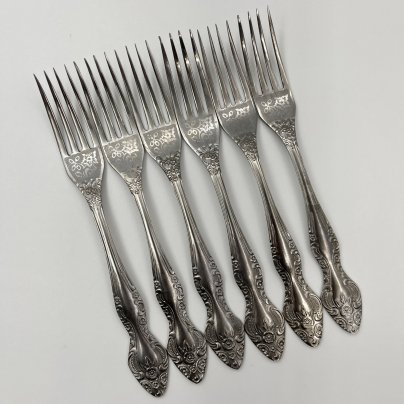 Набор из 6 столовых вилок, украшенных флоральным декором, нержавеющая сталь, Павловский завод художественных металлоизделий им. С.М. Кирова, СССР, 1973-1990 гг.