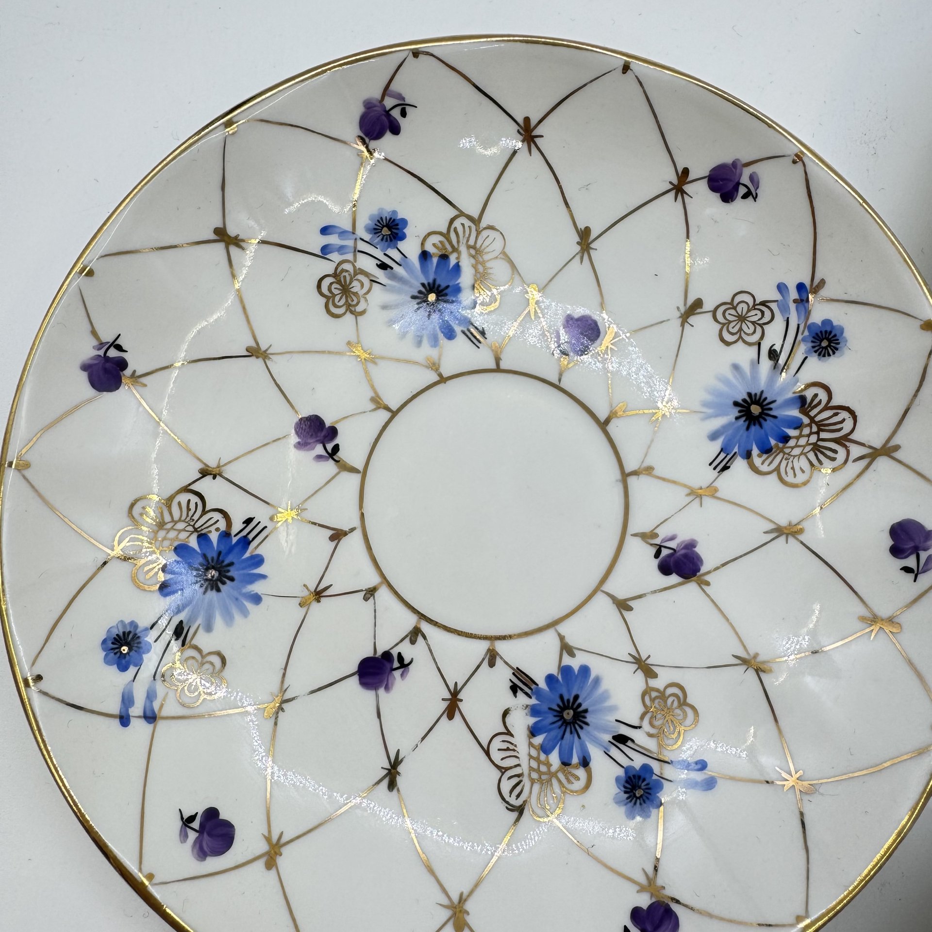 Набор из 4 блюдец с цветочным узором в подборе, Ленинградский фарфоровый завод (ЛФЗ)
