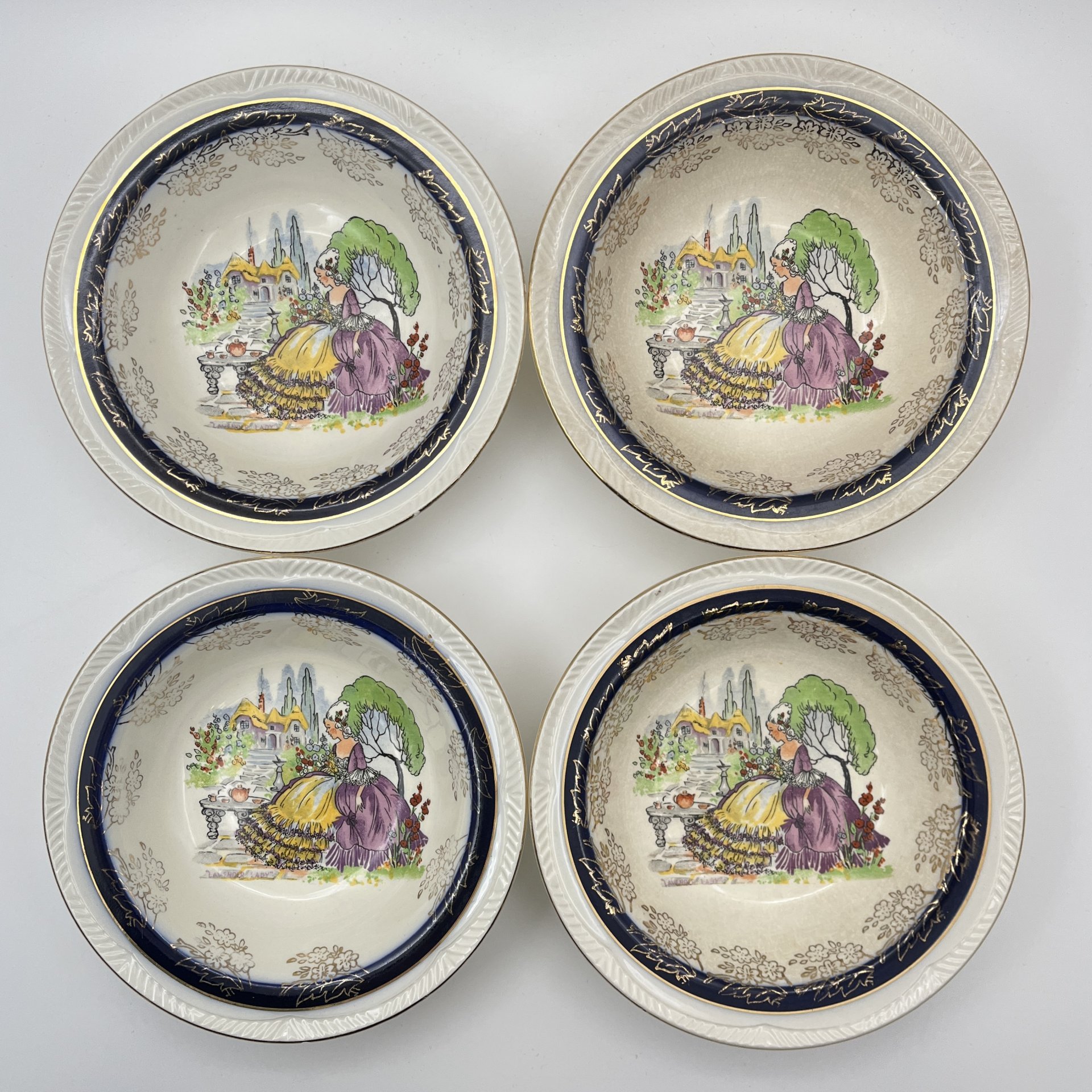 Набор из 4-х суповых тарелок (пиал), украшенных изображением дамы в саду, Winterton Pottery (Longton), фаянс, деколь, золочение, Великобритания, 1949-1954 гг.