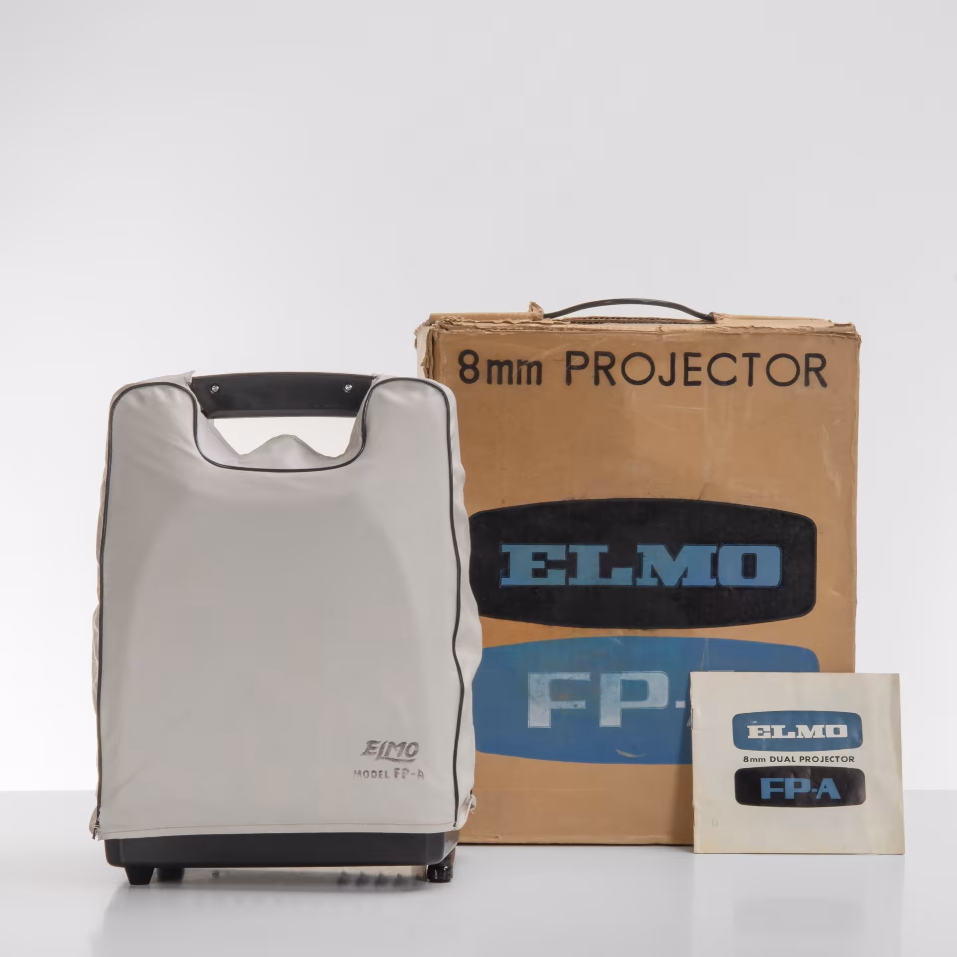 Кинопроектор "Elmo model FP-A" с объективом "Elmo zoom F: 1.3"