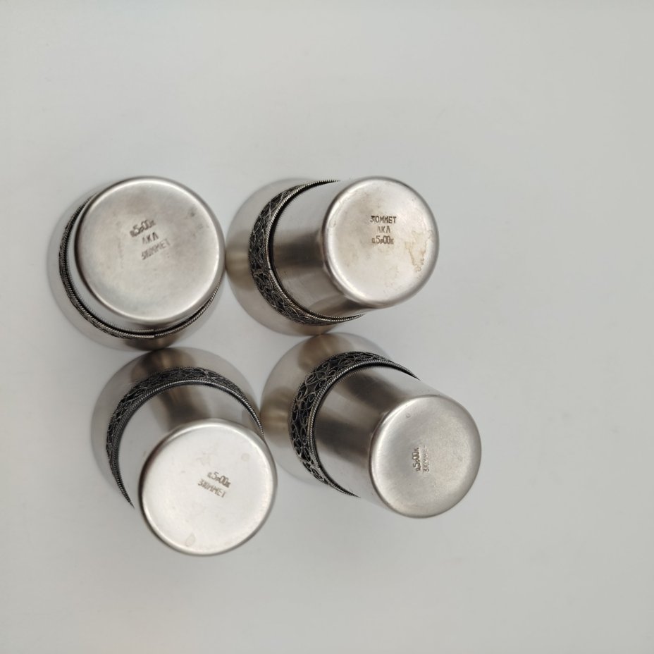 Набор из четырех стопок, декорированных орнаментальным пояском, мельхиор (медь-никель), скань, Мстерская художественная фабрика  «Ювелир», СССР, 1973 г.