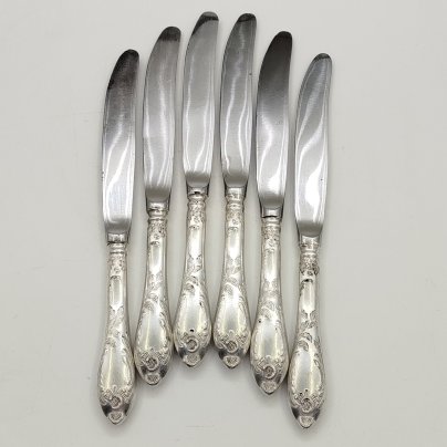 Набор из шести десертных ножей с растительным декором, мНЦ (медь-никель-цинк), сталь, Вольнянский завод столовых приборов им. Шевченко (ЗiШ, ЗиШ), СССР, 1960-1990 гг.