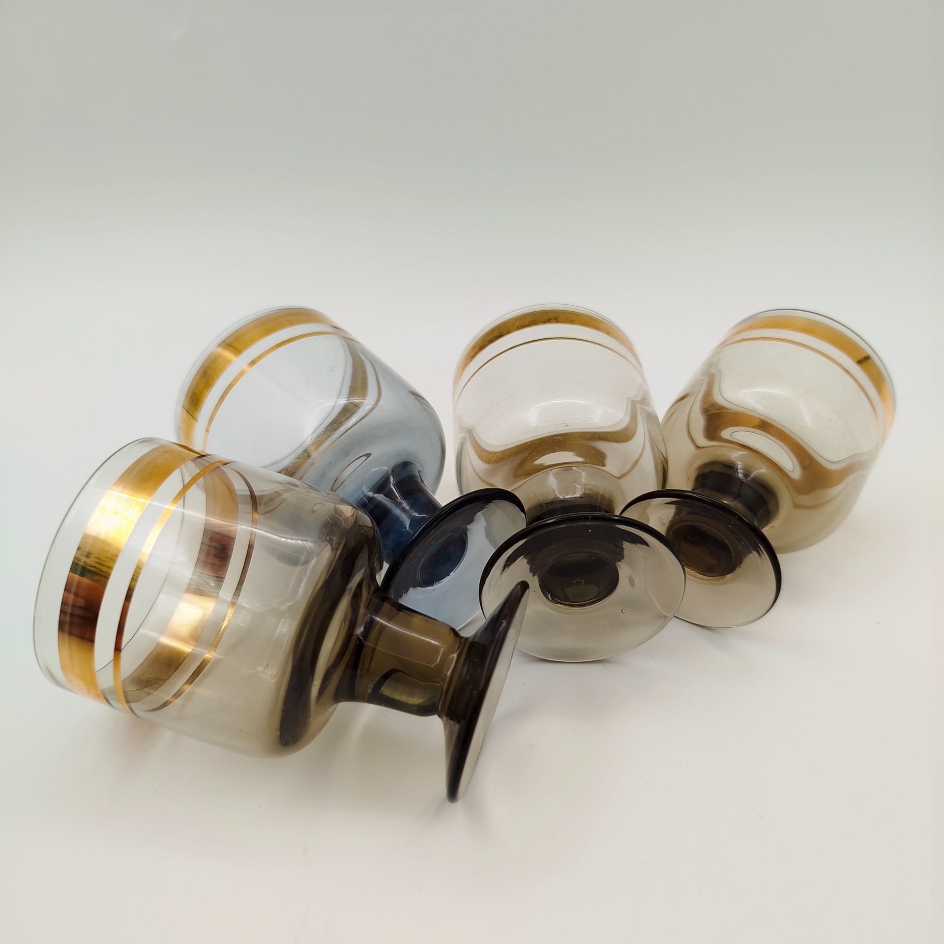 Набор из 4 ликерных рюмок (в подборе), цветное стекло, золочение, СССР, 1970-1990 гг.