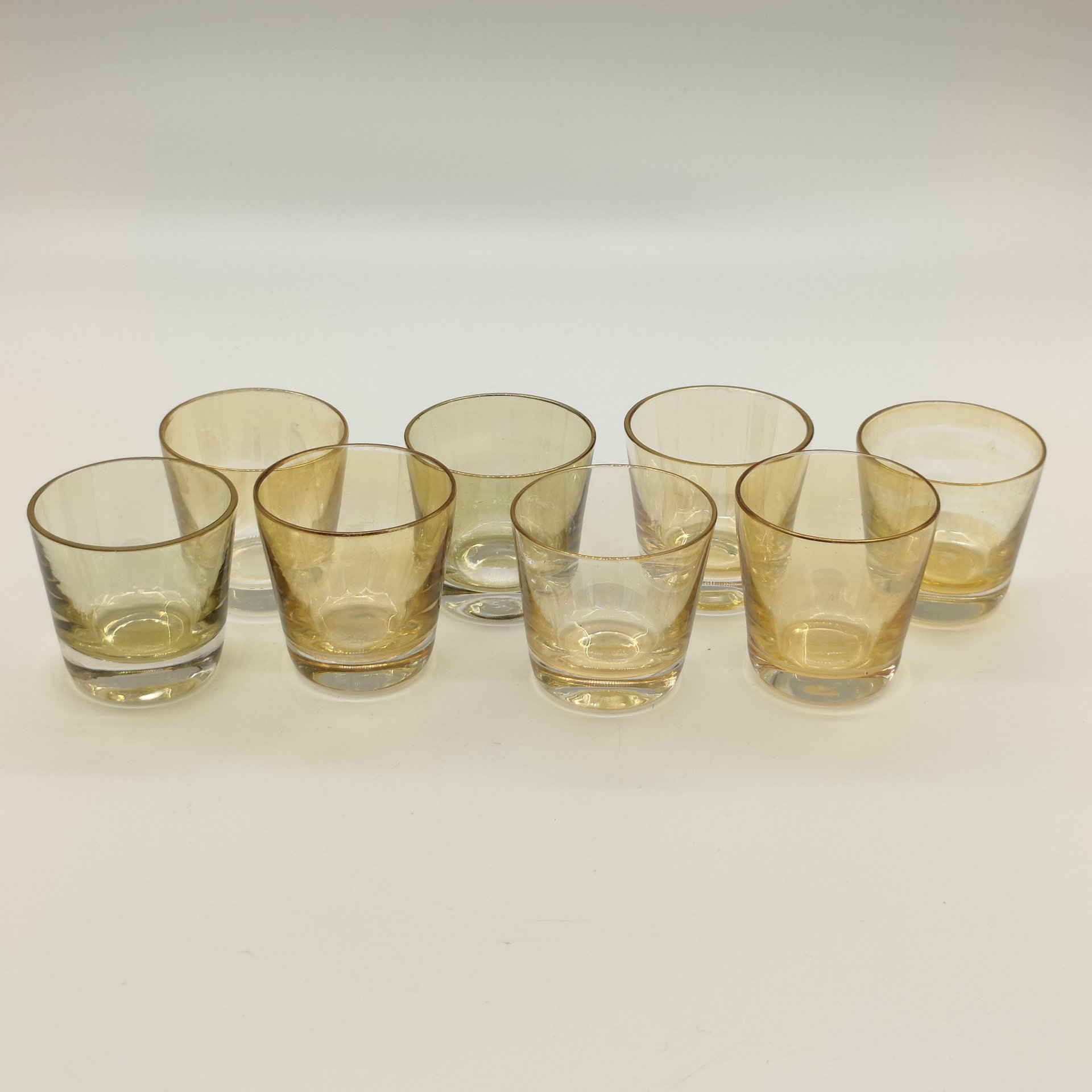 Набор стопок желтого оттенка на 8 персон, цветное стекло, золочение, СССР, 1970-1990 гг.