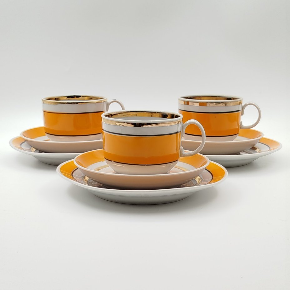 Сервиз чайный в бело-оранжевой гамме на 3 персоны (10 предметов), фарфор, крытье, золочение, Южноуральский фарфоровый завод (ЮФЗ), СССР, 1974-1984 гг.