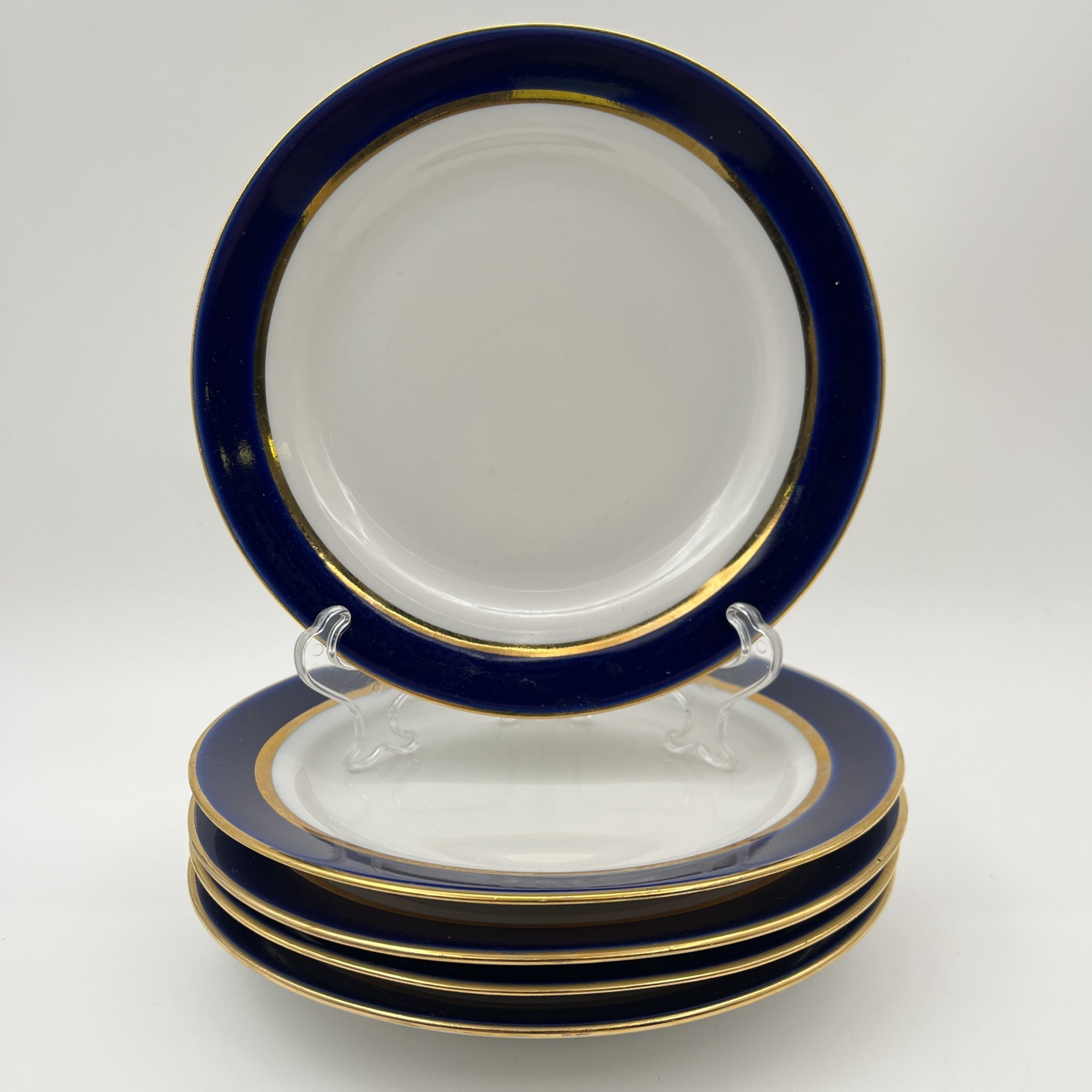 Набор из 5-ти закусочных тарелок, украшенных ленточным декором, фарфор, крытье, золочение, Дулевский фарфоровый завод (Дулёво), СССР, 1989 г.