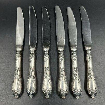 Набор из шести десертных ножей с растительным декором, мНЦ (медь-никель-цинк), сталь, Вольнянский завод столовых приборов им. Шевченко (ЗiШ, ЗиШ), СССР, 1960-1980 гг.
