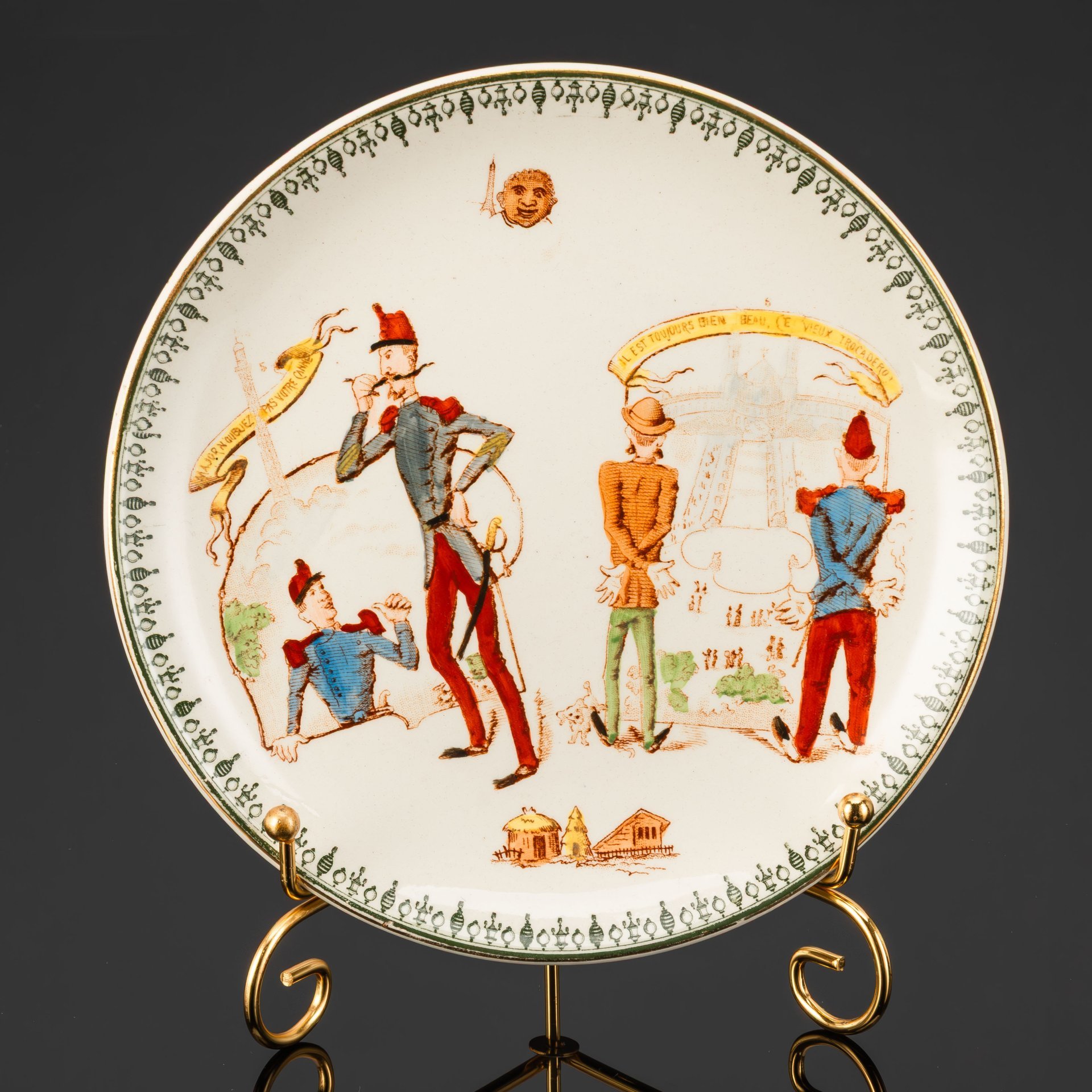 Тарелка с юмористическим изображением на тему застройки Парижа "Трость - Эйфелева башня" и "Площадь Трокадеро", фаянс, деколь, подрисовка, золочение, Hippolyte Boulenger & Cie (H.B. & Cie Choisy-le-Roi), Франция, 1880-1890 гг.