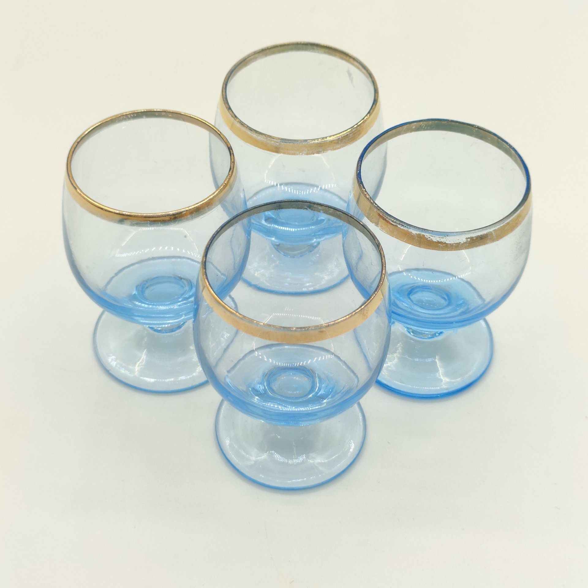 Набор из 4-х ликерных рюмок голубого оттенка, цветное стекло, золочение, СССР, 1970-1990 гг.