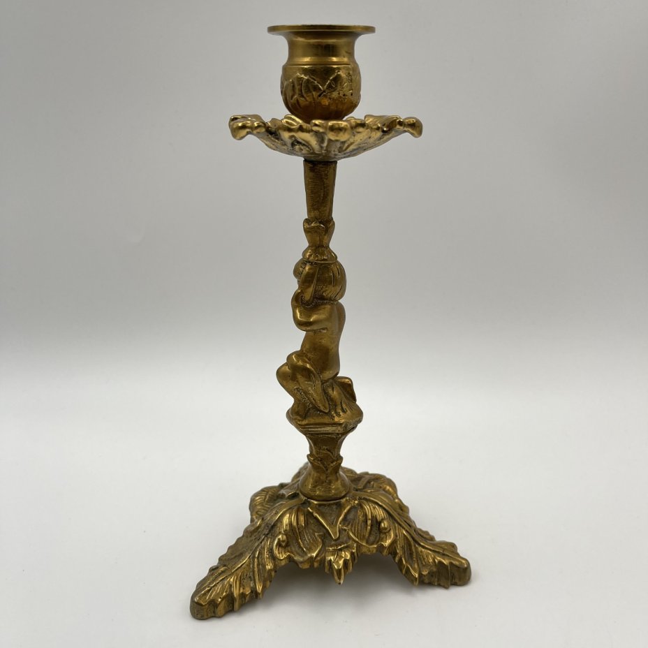 Подсвечник на фигурном основании в виде юноши с растительным побегом