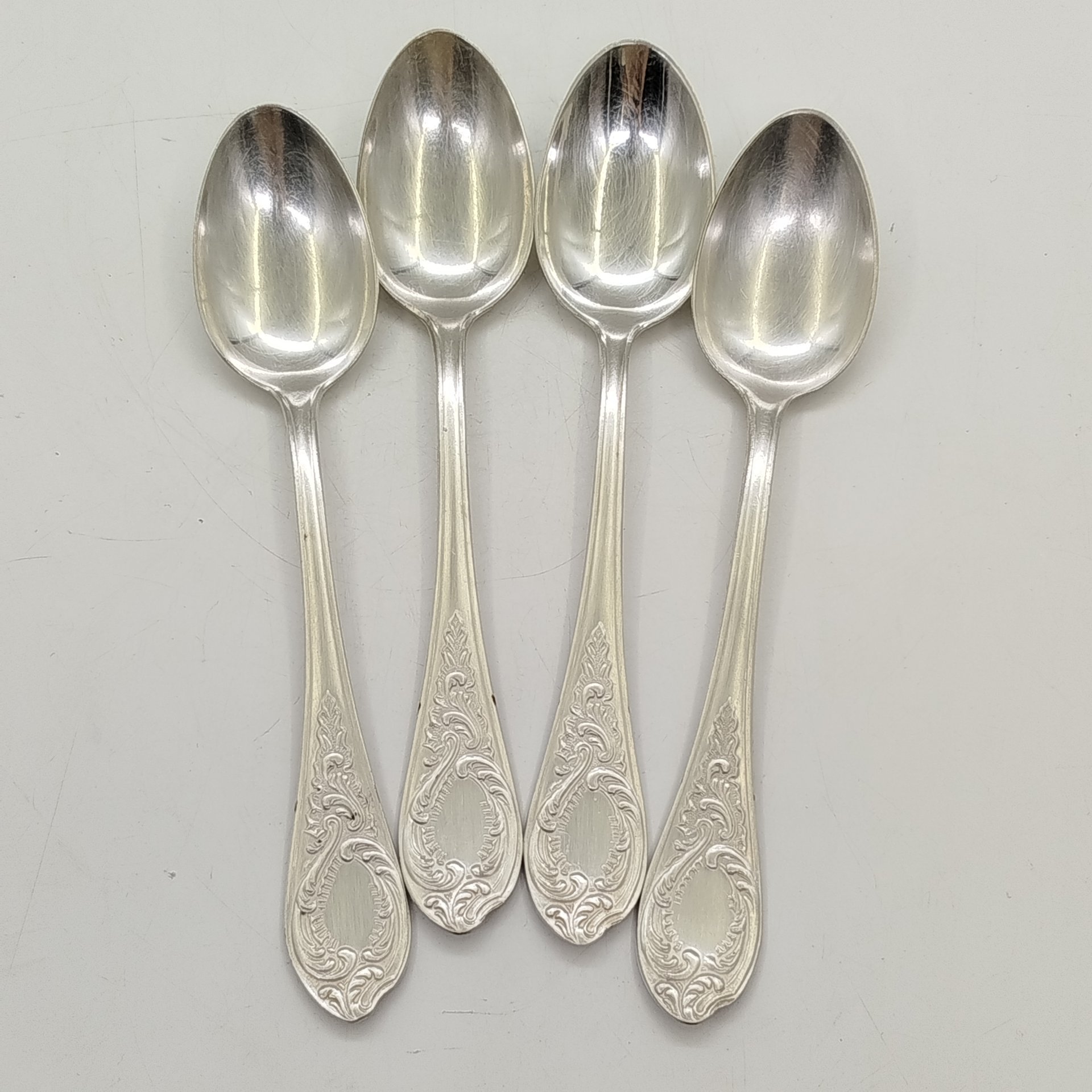 Набор из 4-х ложек с растительным декором, мНЦ (медь-никель-цинк), Киевский завод столовых приборов и посуды им. Дзержинского (ЗiД, ЗиД), СССР, 1962-1972 гг.