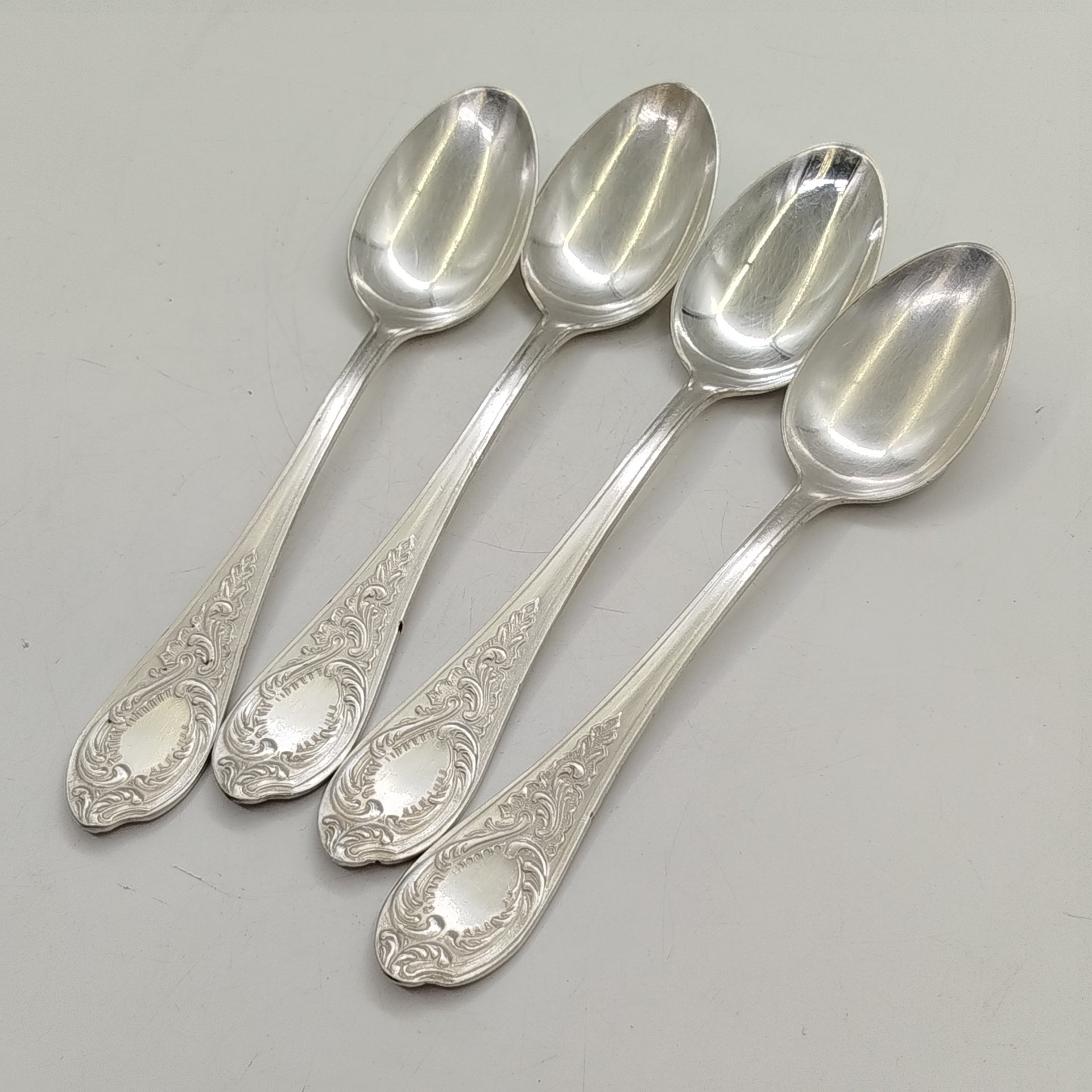 Набор из 4-х ложек с растительным декором, мНЦ (медь-никель-цинк), Киевский завод столовых приборов и посуды им. Дзержинского (ЗiД, ЗиД), СССР, 1962-1972 гг.