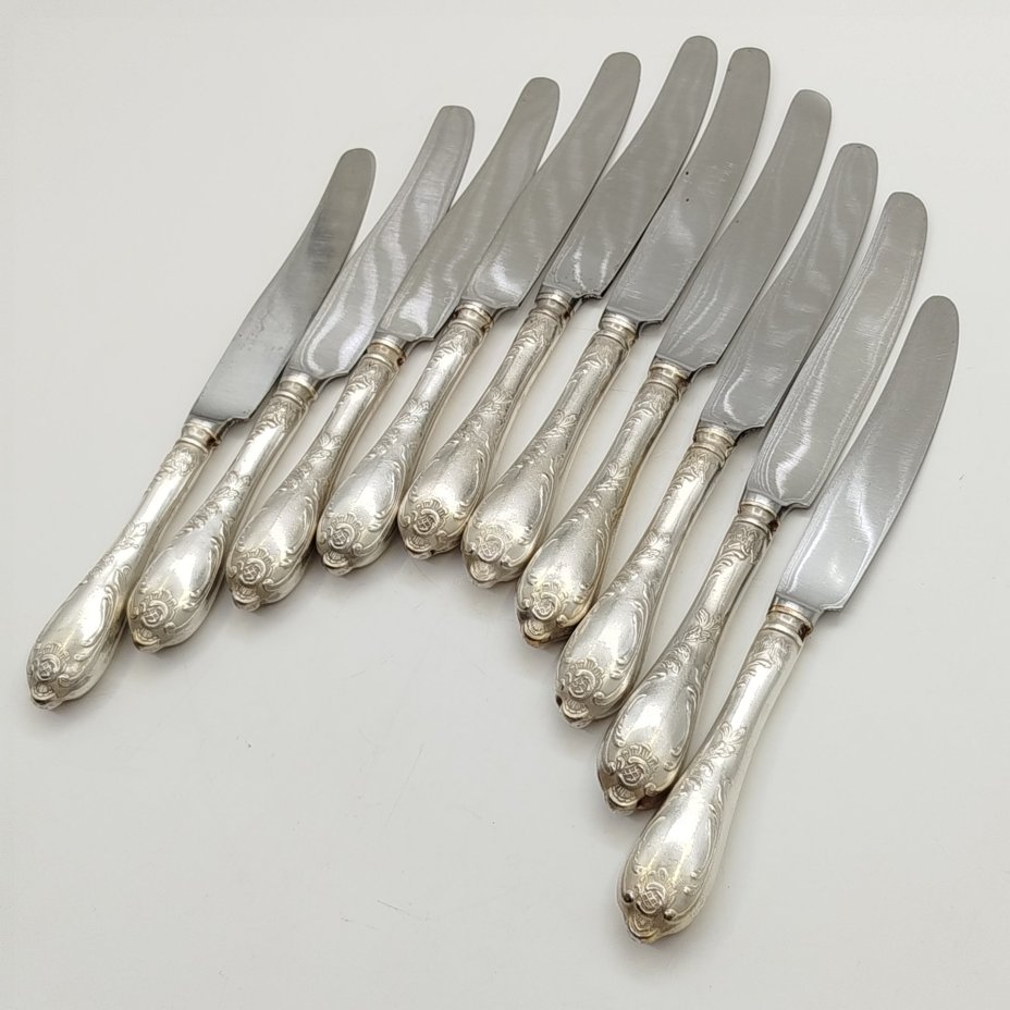 Набор из десяти десертных ножей с растительным декором, мНЦ (медь-никель-цинк), сталь, Вольнянский завод столовых приборов им. Шевченко (ЗiШ, ЗиШ), СССР, 1960-1990 гг.