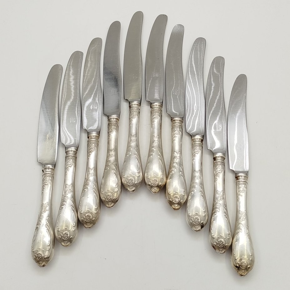 Набор из десяти десертных ножей с растительным декором, мНЦ (медь-никель-цинк), сталь, Вольнянский завод столовых приборов им. Шевченко (ЗiШ, ЗиШ), СССР, 1960-1990 гг.