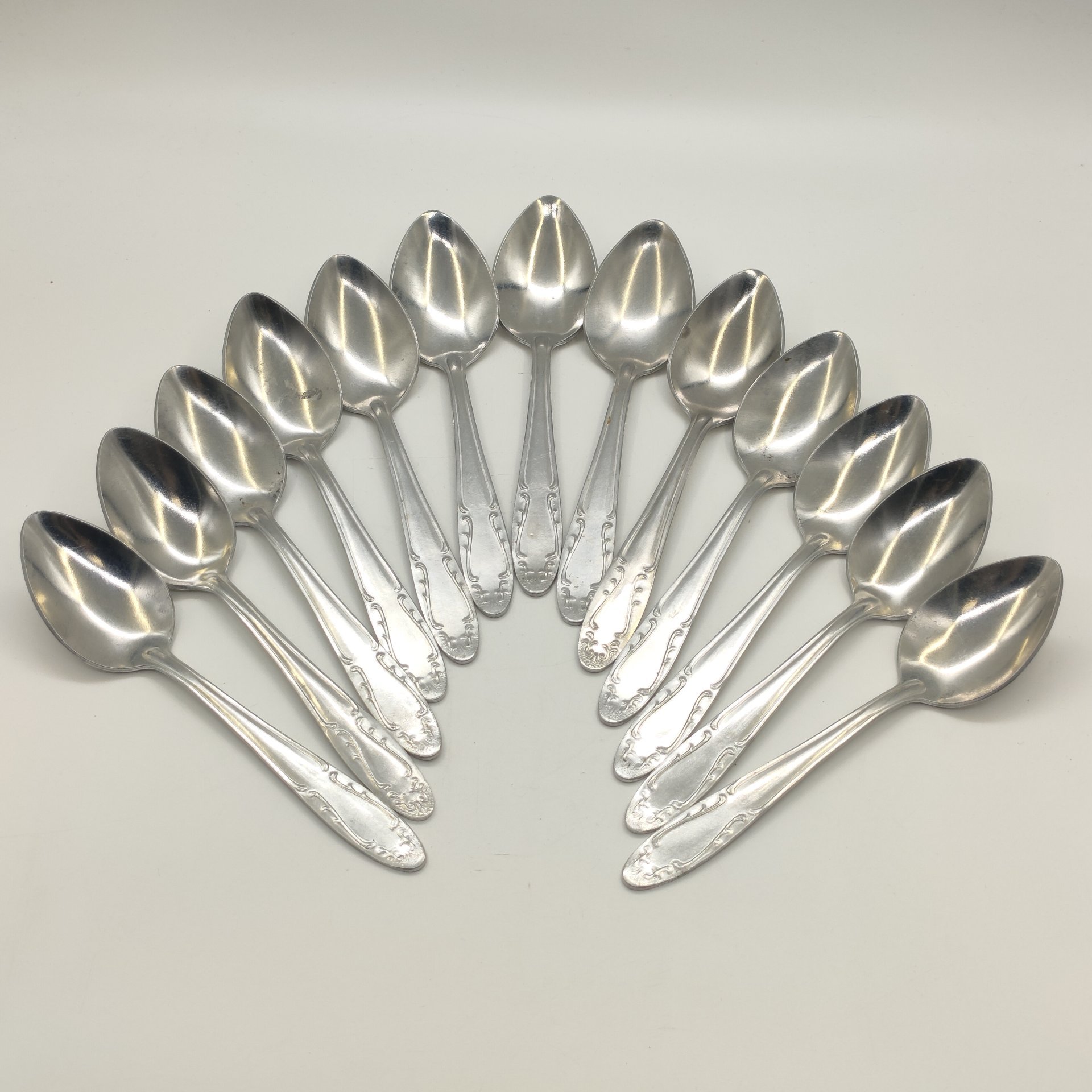 Набор из 13-ти столовых ложек с растительным декором, Производственное объединение "Мосметаллопосуда", алюминий, СССР, 1972-1982 гг.