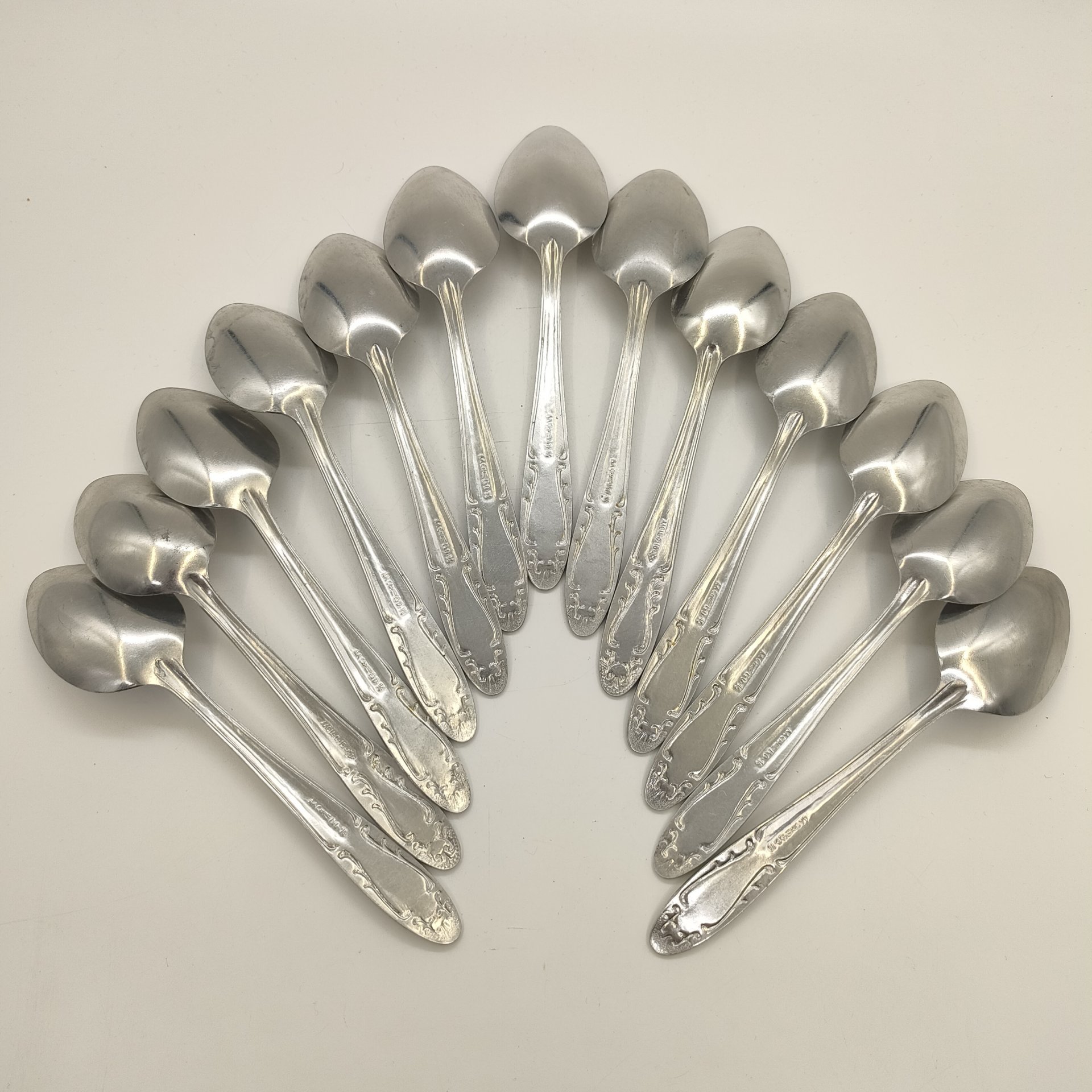 Набор из 13-ти столовых ложек с растительным декором, Производственное объединение "Мосметаллопосуда", алюминий, СССР, 1972-1982 гг.