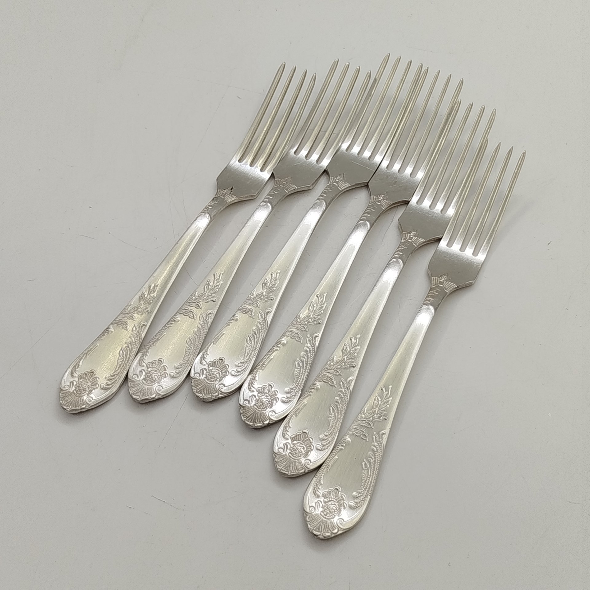 Набор из шести десертных вилок с растительным декором, мНЦ (медь-никель-цинк), Вольнянский завод столовых приборов им. Шевченко (ЗiШ, ЗиШ), СССР, 1960-1980 гг.