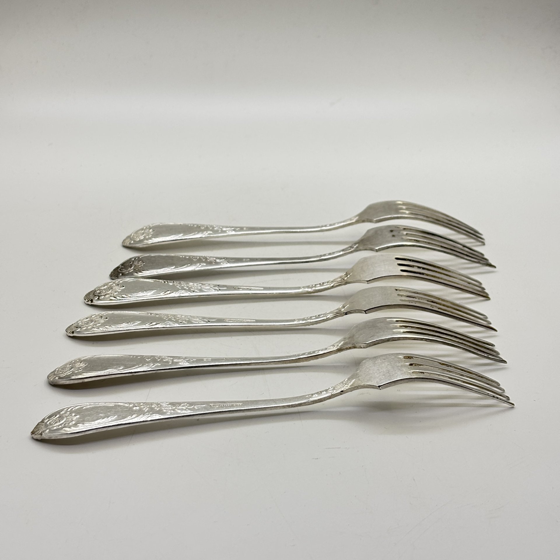 Набор из шести обеденных вилок с растительным декором, мНЦ (медь-никель-цинк), Вольнянский завод столовых приборов им. Шевченко (ЗiШ, ЗиШ), СССР, 1960-1980 гг.